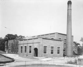 Photograph of a building and a smokestack at the Nova Scotia Technical College