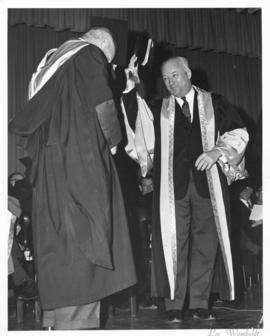 Photograph of Henry Hicks conferring a degree on an unidentified person