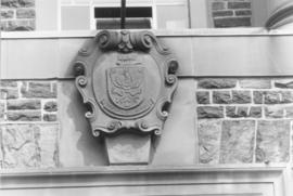 Photograph of a crest on the Henry Hicks Arts & Administration Building