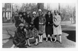 Photograph and a photographic negative of eight students and alumnae