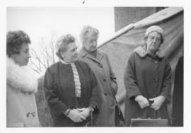 Photograph of four people at the Cornerstone Ceremony - outside CNA House in Ottawa