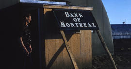 Photograph of a man at the Bank of Montreal in Frobisher Bay, Northwest Territories