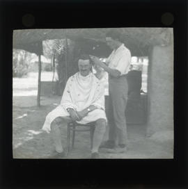 Photograph of a person getting a haircut