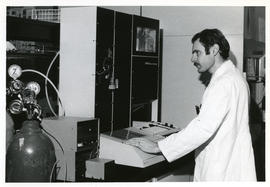 Photograph of Harold W. Cook with equipment