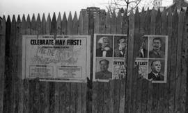 Photograph of posters on a fence