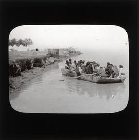 Photograph of a group of people in a rowboat