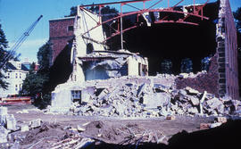 Photograph of the demolition of the Medical-Dental Library with the side of building torn away