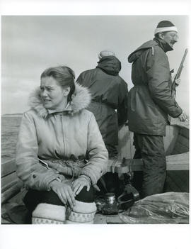 Photograph of Barbara Hinds and two men on a boat