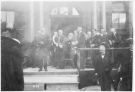 Photograph of an unidentified person speaking on the front steps on Halifax city hall