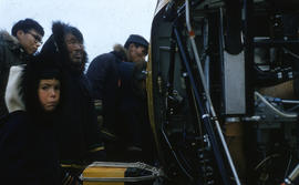 Photograph of people looking at a helicopter in Cape Dorset, Northwest Territories