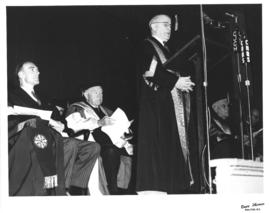Photograph of A. E. Kerr giving an address at a ceremony