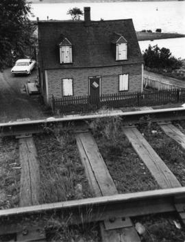 Photograph of a boarded-up house in Africville