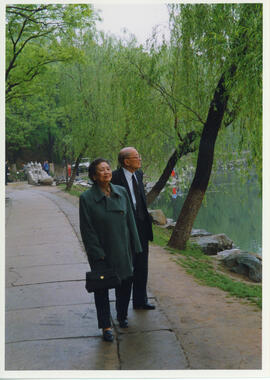 Photograph of Wang Tieya and his wife walking near the Nameless Lake, Peking University
