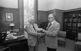 Photograph of Oland's presenting a cheque to Henry Hicks