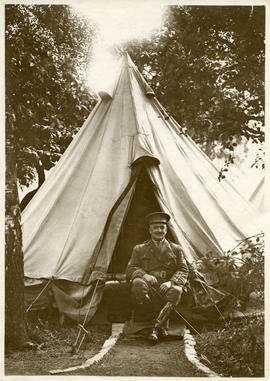 Officer sitting in front of his tent