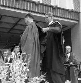 Photograph of a degree being awarded at the Dalhousie medical centennial convocation ceremony