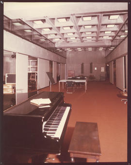 Photograph of a piano and tables in the Killam Memorial Library