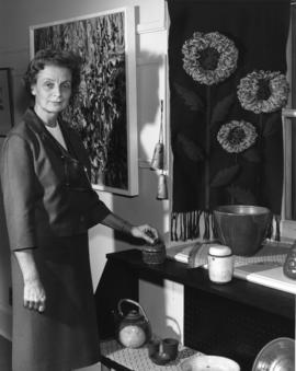 Photograph of Evelyn Holmes with pottery