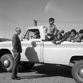 Photograph of a pickup truck with several children in the back in Fort Chimo, Quebec