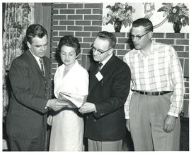 Photograph of four people at miscellaneous health-related event