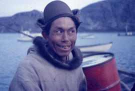 Photograph of a man with a tan parka and brown hat in Newfoundland and Labrador