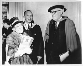 Photograph of Lady Dunn smiling with two unidentified people