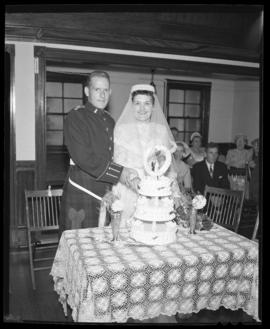 Photograph of Mr. & Mrs. Leil cutting the wedding cake