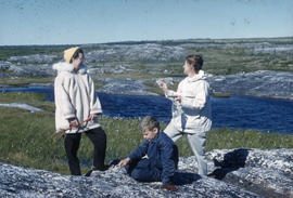 Photograph of two women and a boy on the tundra in Fort Chimo, Quebec