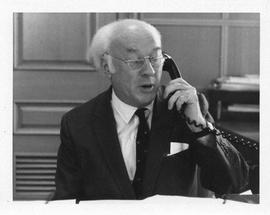 Photograph of Henry Hicks speaking on the phone