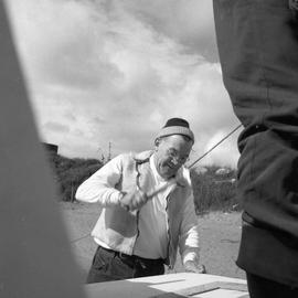 Photograph of Bill Walker hammering a nail in Fort Chimo, Quebec