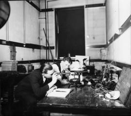 Photograph of a men in a chemical research laboratory in the Science Building