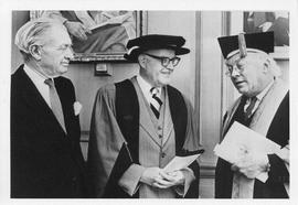 Photograph of Henry Hicks and two unidentified people in academic dress