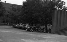 Photograph of vehicles parked in front of the Killam Memorial Library in 1988