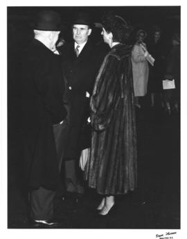 Photograph of E. C. Plow and Lady Dunn talking to an unidentified man