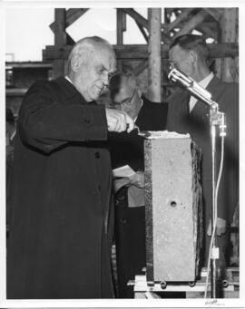Photograph of C. D. Howe at the laying of a cornerstone for the men's residence