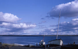 Photograph of small boats and canoes on the shore in northern Quebec