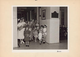 Photograph of children and nurses in Outpatient and Public Health Clinic