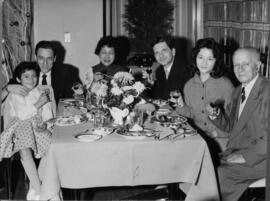 Photograph of Klaus Pringsheim and others at a table