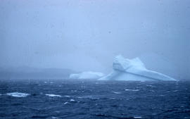 Photograph of an iceberg in a storm near Cape Dorset, Northwest Territories