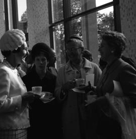 Photograph of four unidentified people with teacups