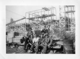 Photograph of a group of men at the construction site of the Arts & Administration Building