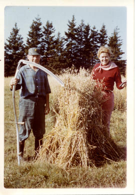 Photograph of Barbara Hinds and an unidentified man with a wheat sheaf
