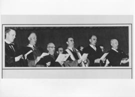Photograph of people singing at a convocation ceremony