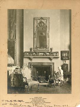 Photograph of Harris Brown sitting by a fireplace