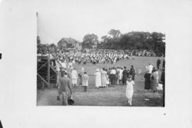 Photograph of a performance on a field during a Dalhousie reunion