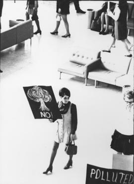Photograph of a Mount Saint Vincent student at the Halifax airport protesting the landing of a Un...