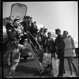 Photograph of the Privateers musical group returning from Osaka, Japan