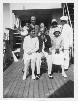 Photograph of Arthur Stanley MacKenzie and other unidentified people on a cruise ship