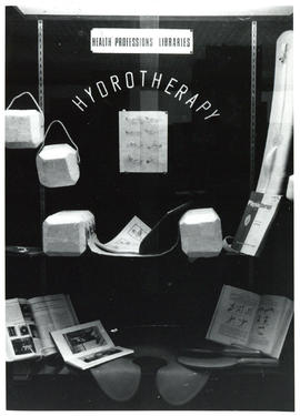 Photograph of display case exhibit on Health Professions Libraries and Hydrotherapy