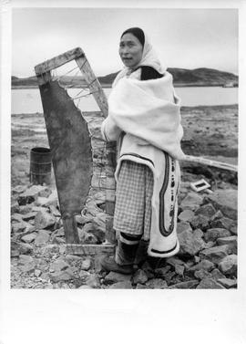Photograph of a woman named Lipitia with a stretched seal skin
